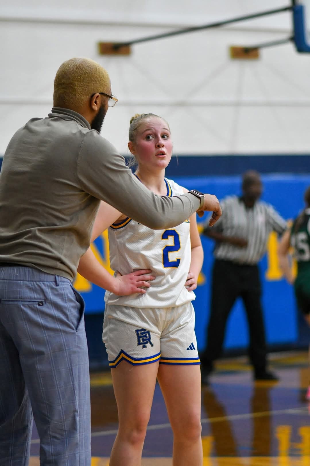 Jeahna Schmidt getting instruction from her coach